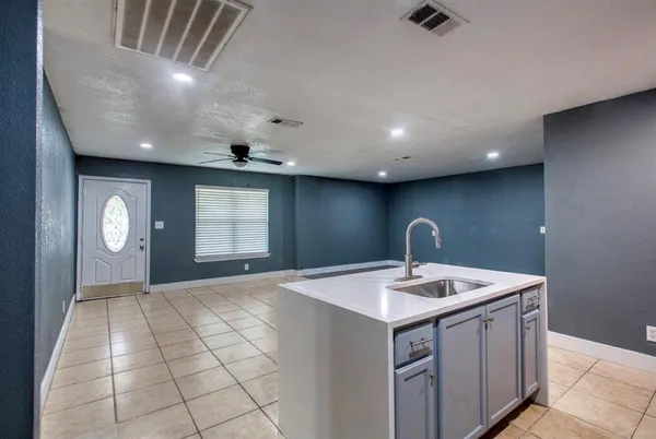 a kitchen with a sink and dishwasher