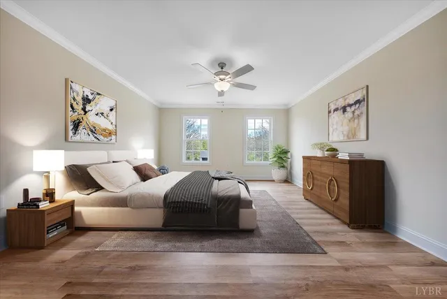 a spacious bedroom with a large bed and a chandelier