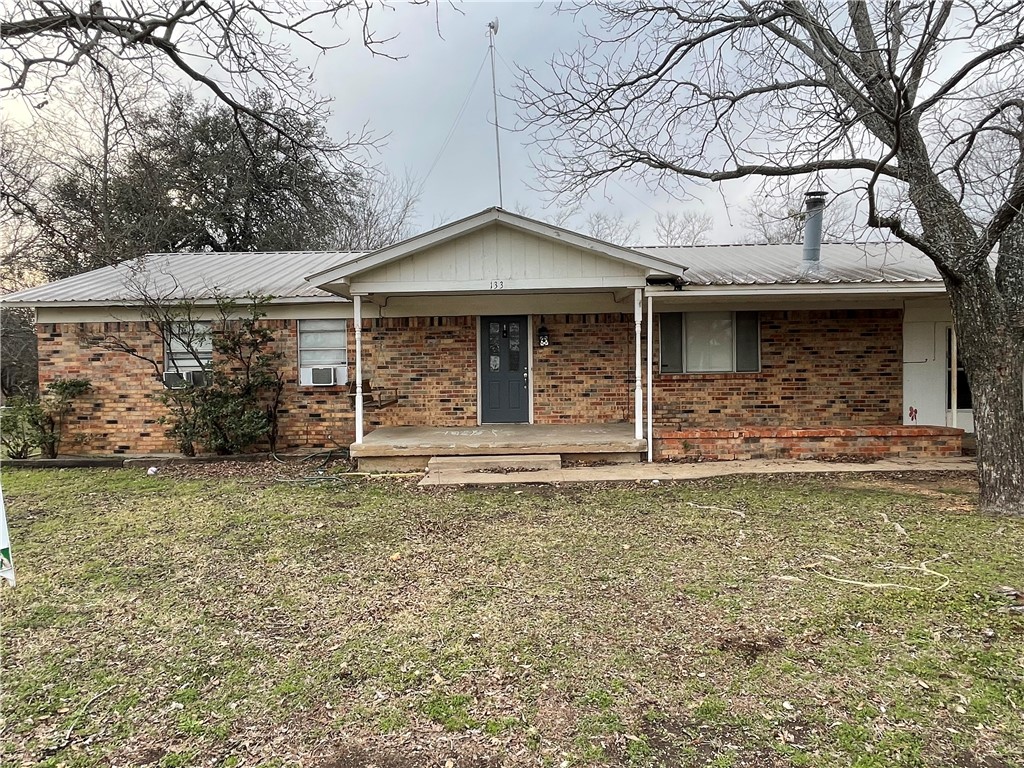 a house with trees in the background