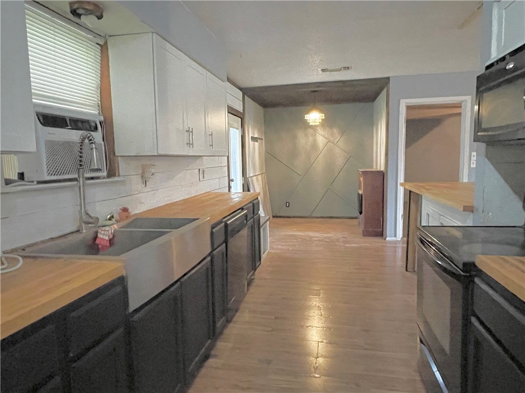 133 Wayman Drive Whitney, TX 76692 - Photo 12 of 38 a kitchen with stainless steel appliances a sink stove and cabinets