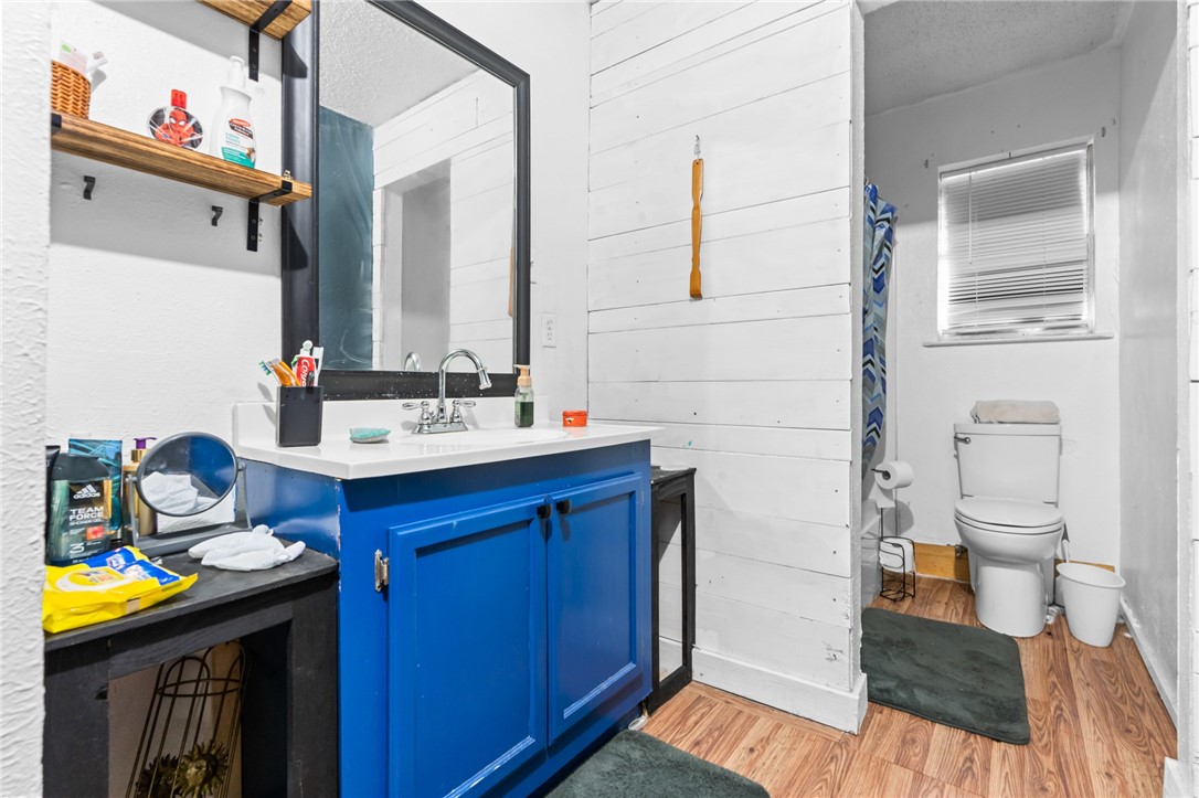 133 Wayman Drive Whitney, TX 76692 - Photo 18 of 38 a bathroom with a sink and a mirror
