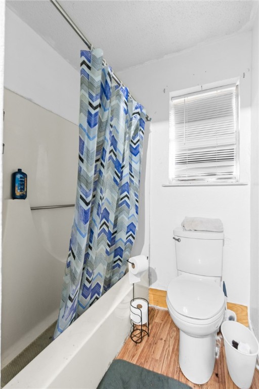 133 Wayman Drive Whitney, TX 76692 - Photo 19 of 38 a white toilet sitting next to a bath tub