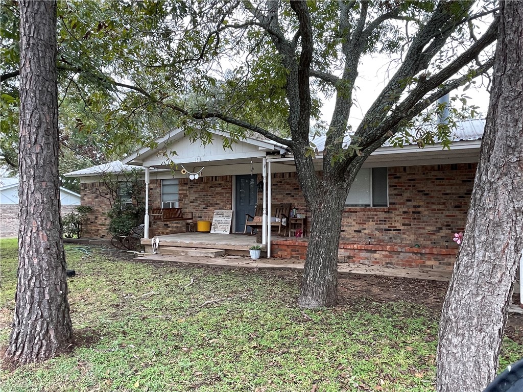 133 Wayman Drive Whitney, TX 76692 - Photo 2 of 38 a view of a house with backyard porch and sitting area
