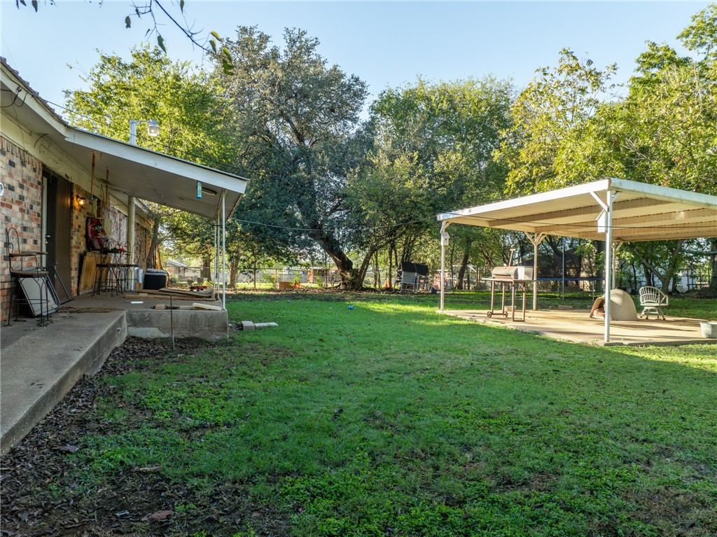 133 Wayman Drive Whitney, TX 76692 - Photo 28 of 38 a view of a swimming pool with lawn chairs under an umbrella