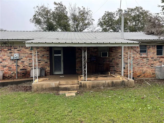 a front view of a house with patio