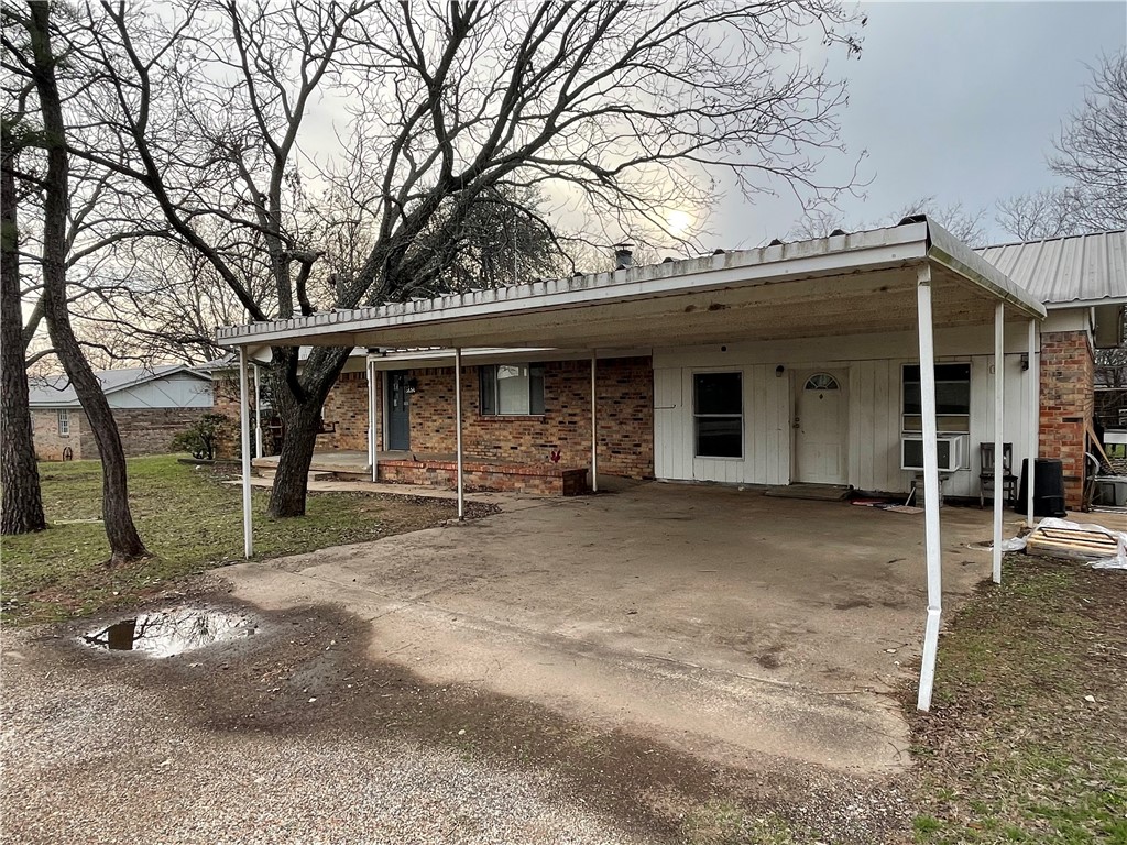 133 Wayman Drive Whitney, TX 76692 - Photo 3 of 38 a view of a house with a yard and large tree