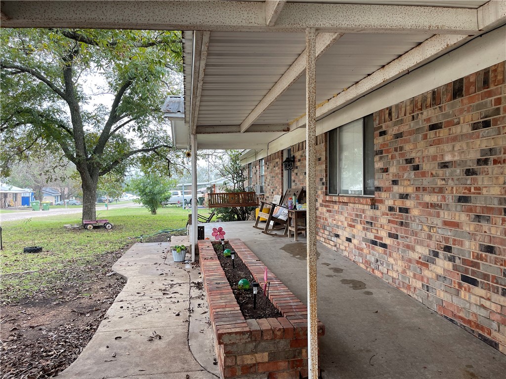 133 Wayman Drive Whitney, TX 76692 - Photo 4 of 38 a view of a patio with table and chairs next to a yard
