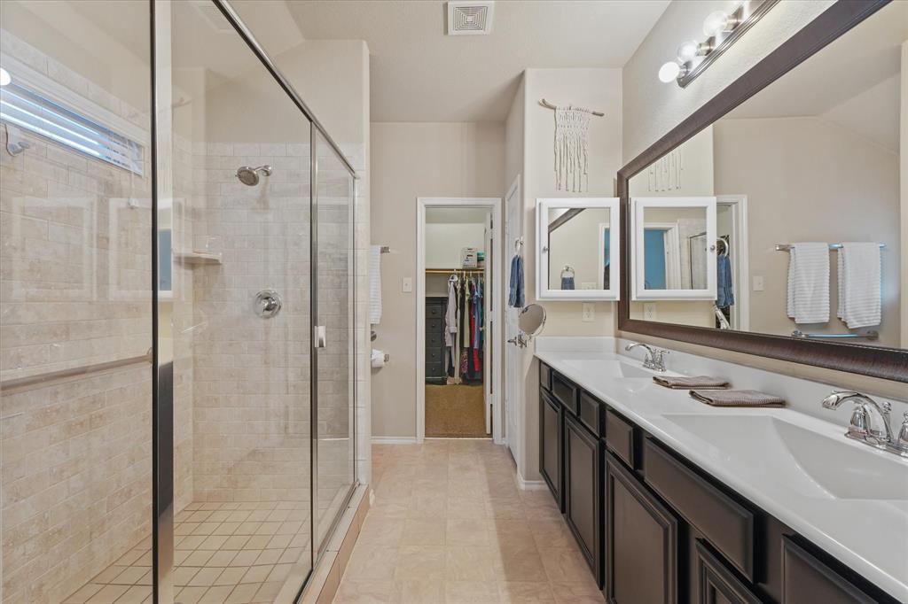 409 Harding Lane Lavon, TX 75166 - Photo 12 of 34 Enclosed shower with clear glass surround and tiled walls