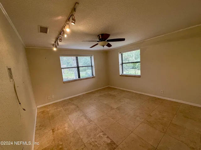 a view of a window in an empty room