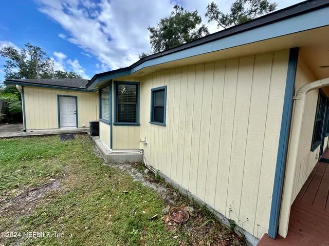 a house with trees in the background