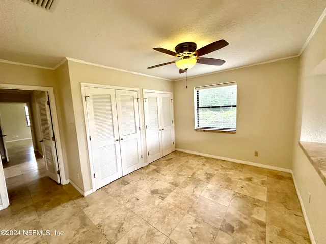 a view of an empty room and window
