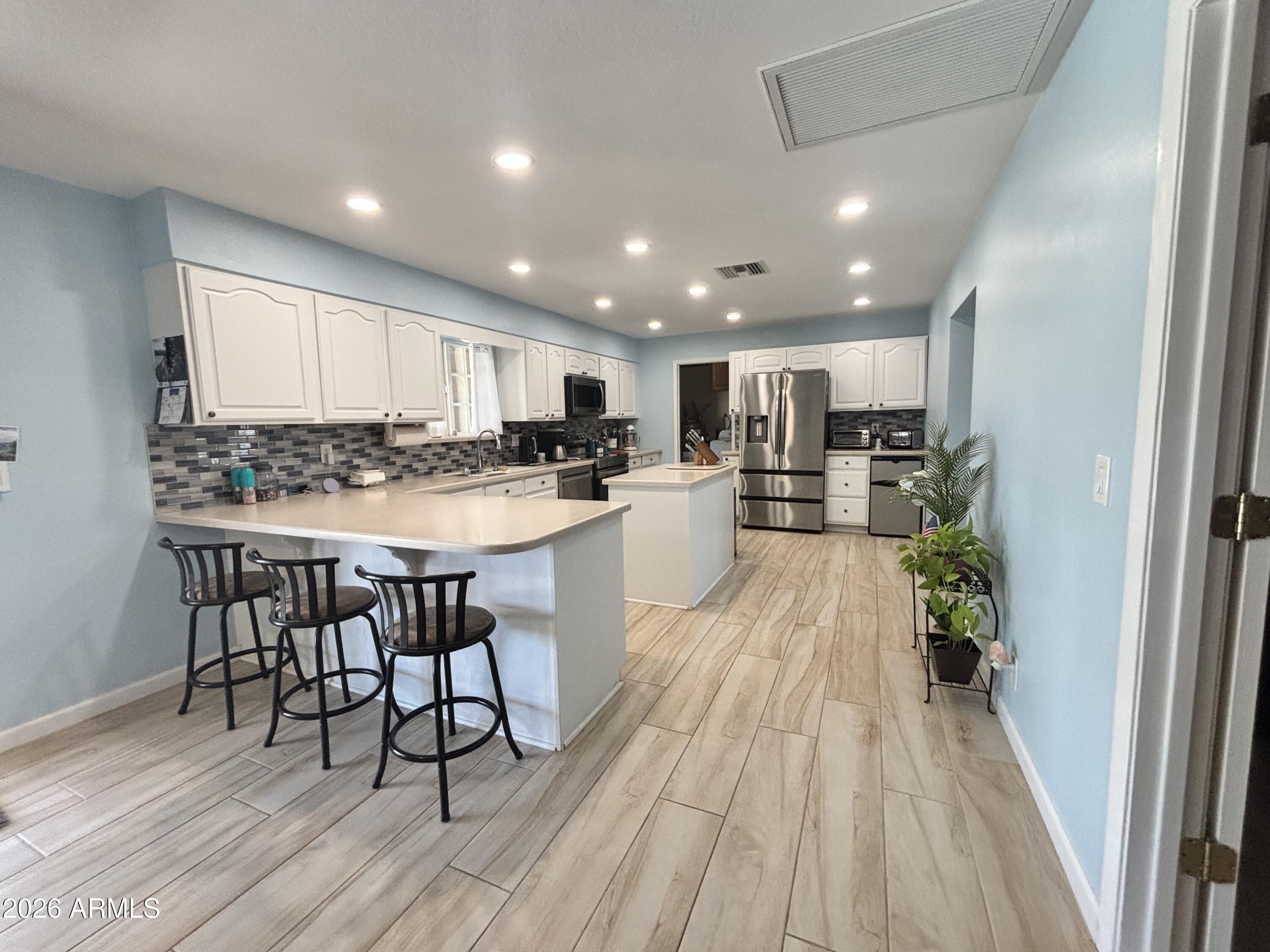 7745 East Mangun Road Mesa, AZ 85207 - Photo 21 of 35 a kitchen with a table and chairs in it
