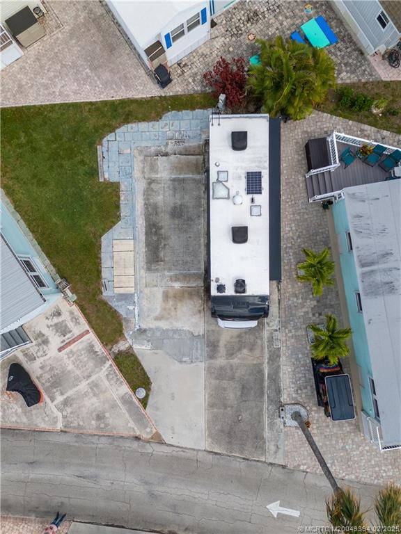 10725 South Ocean Drive, Unit 285 Jensen Beach, FL 34957 - Photo 4 of 7 a view of a house with a yard