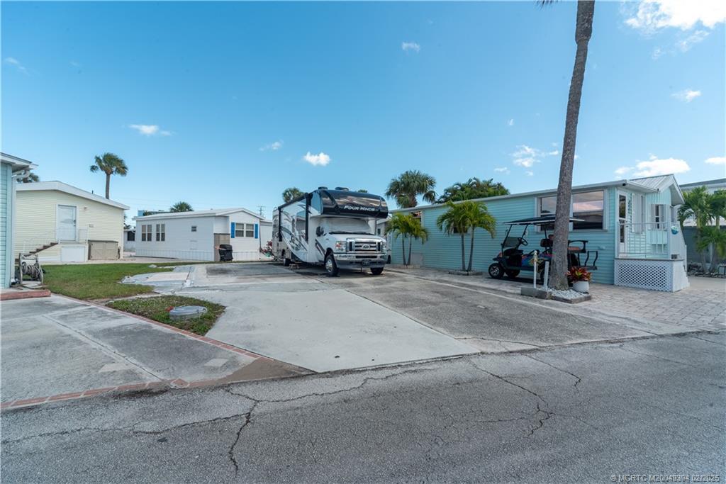 10725 South Ocean Drive, Unit 285 Jensen Beach, FL 34957 - Photo 5 of 7 a view of a street with cars