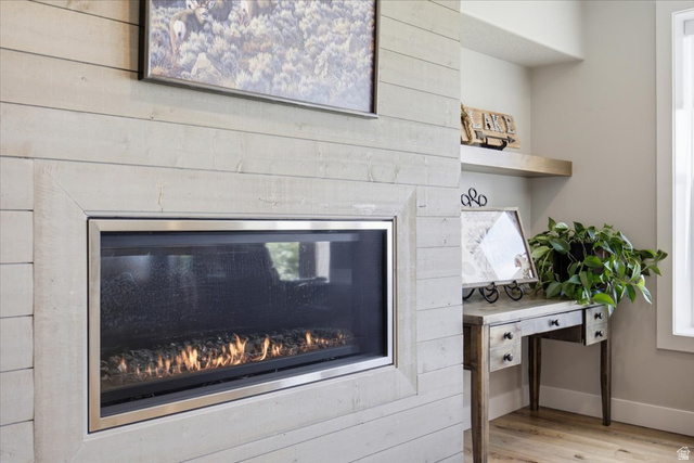 21 Pier Place Tooele, UT 84074 - Photo 71 of 112 Linear fireplace with a stainless steel frame and wood-finish surround