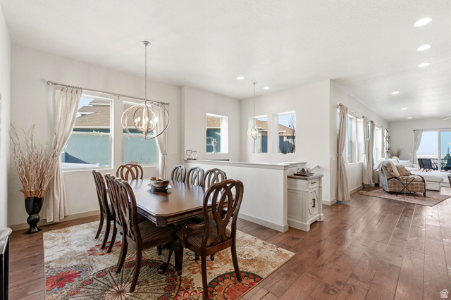 987 East Deer Arch Lane Draper, UT 84020 - Photo 17 of 46 Formal dining area, stairs to basement, area for small table in great room and natural light.
