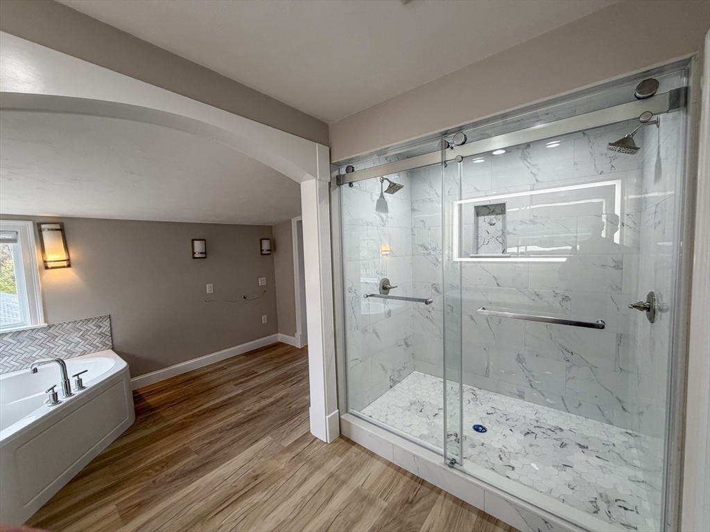 1132 West Boylston Street, Unit 2 Worcester, MA 01606 - Photo 18 of 42 a bathroom with a glass shower door