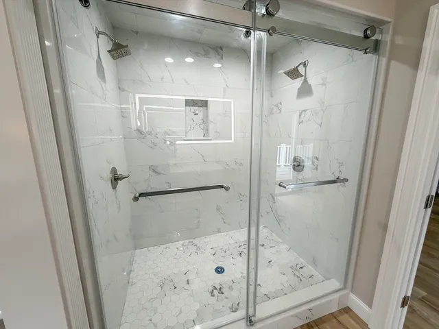 a view of a balcony with wooden floor and fence