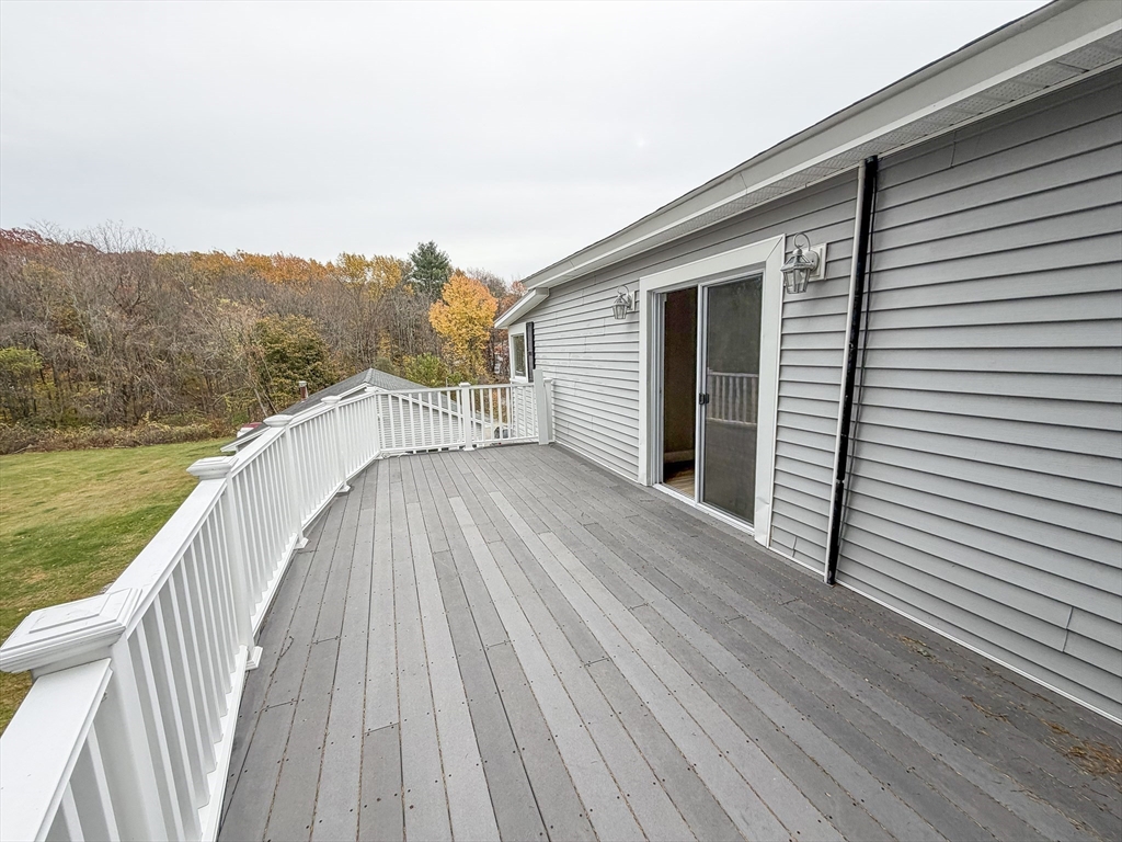 1132 West Boylston Street, Unit 2 Worcester, MA 01606 - Photo 23 of 42 a view of a balcony with wooden floor and fence