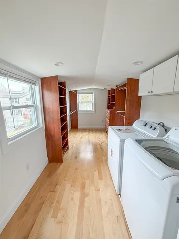 a kitchen with refrigerator and window