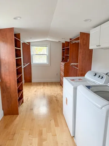 a kitchen with stainless steel appliances granite countertop a refrigerator and a stove