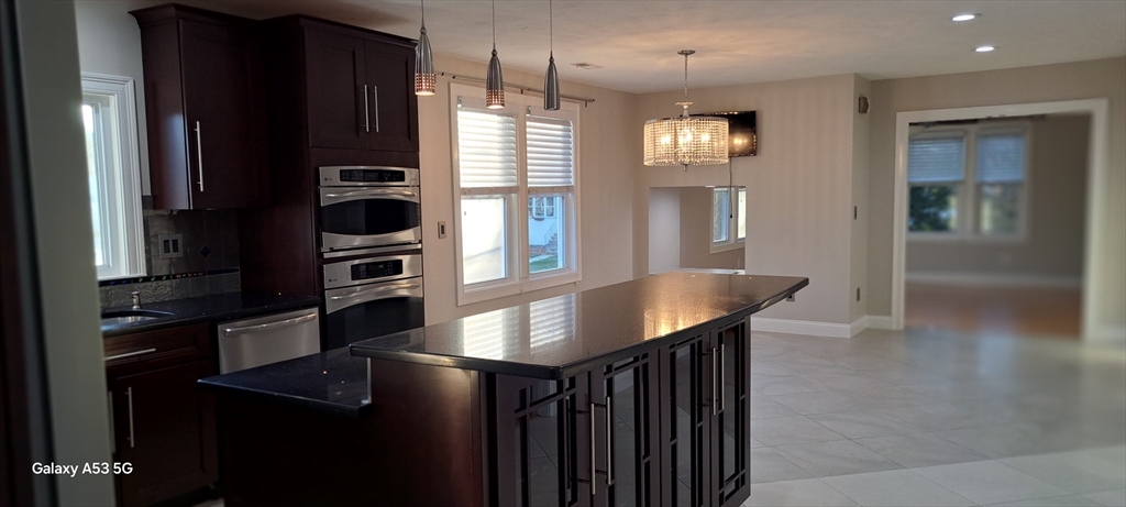 1132 West Boylston Street, Unit 2 Worcester, MA 01606 - Photo 30 of 42 a kitchen with refrigerator and window