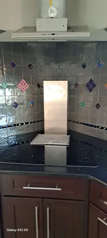 a view of room with window and wooden floor