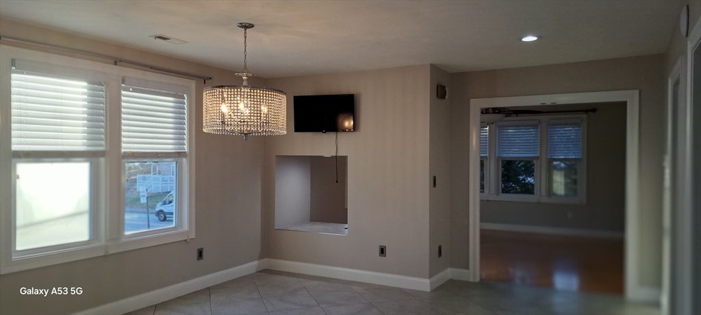 1132 West Boylston Street, Unit 2 Worcester, MA 01606 - Photo 37 of 42 a view of a windows and chandelier in a room