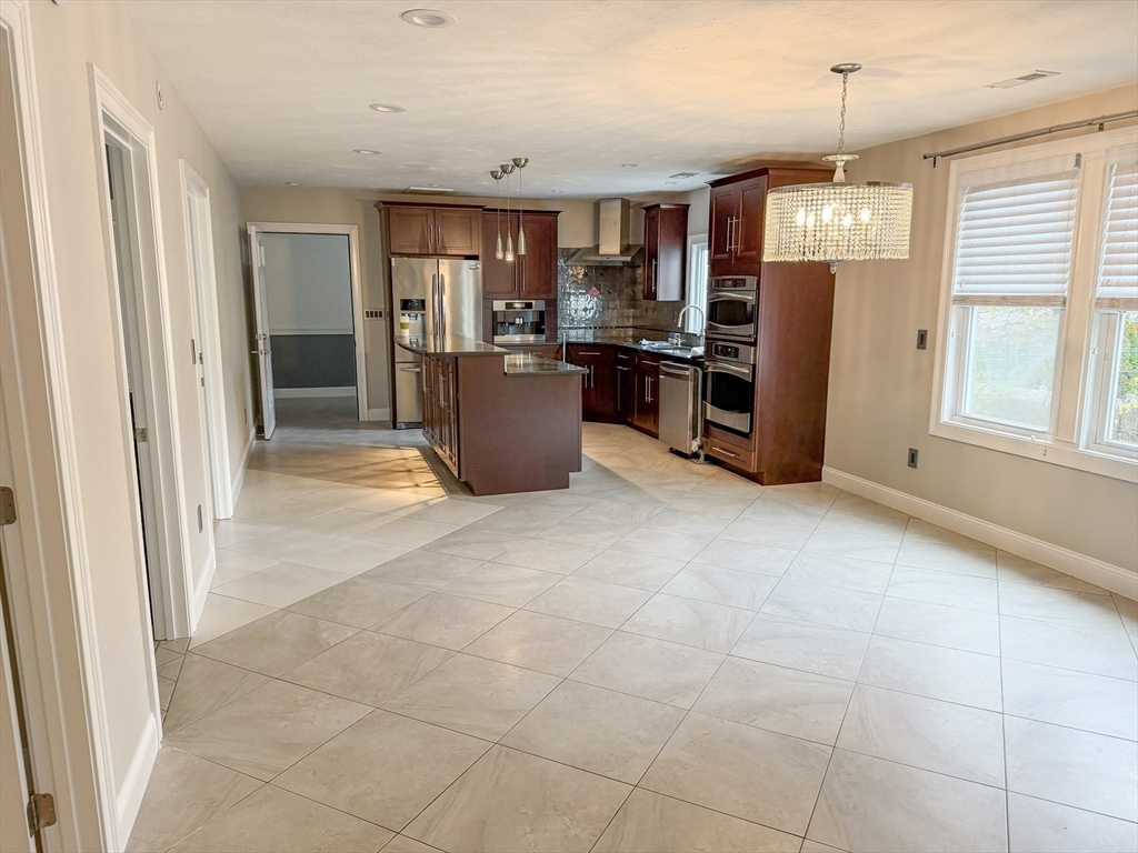 1132 West Boylston Street, Unit 2 Worcester, MA 01606 - Photo 4 of 42 a view of kitchen with refrigerator and window
