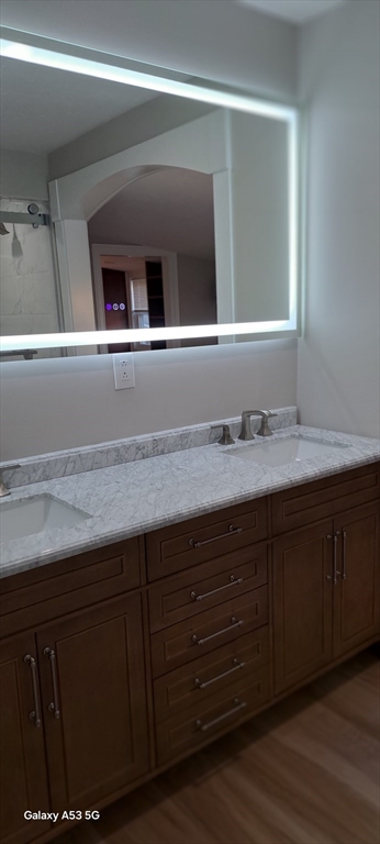 1132 West Boylston Street, Unit 2 Worcester, MA 01606 - Photo 42 of 42 a bathroom with a sink and a mirror