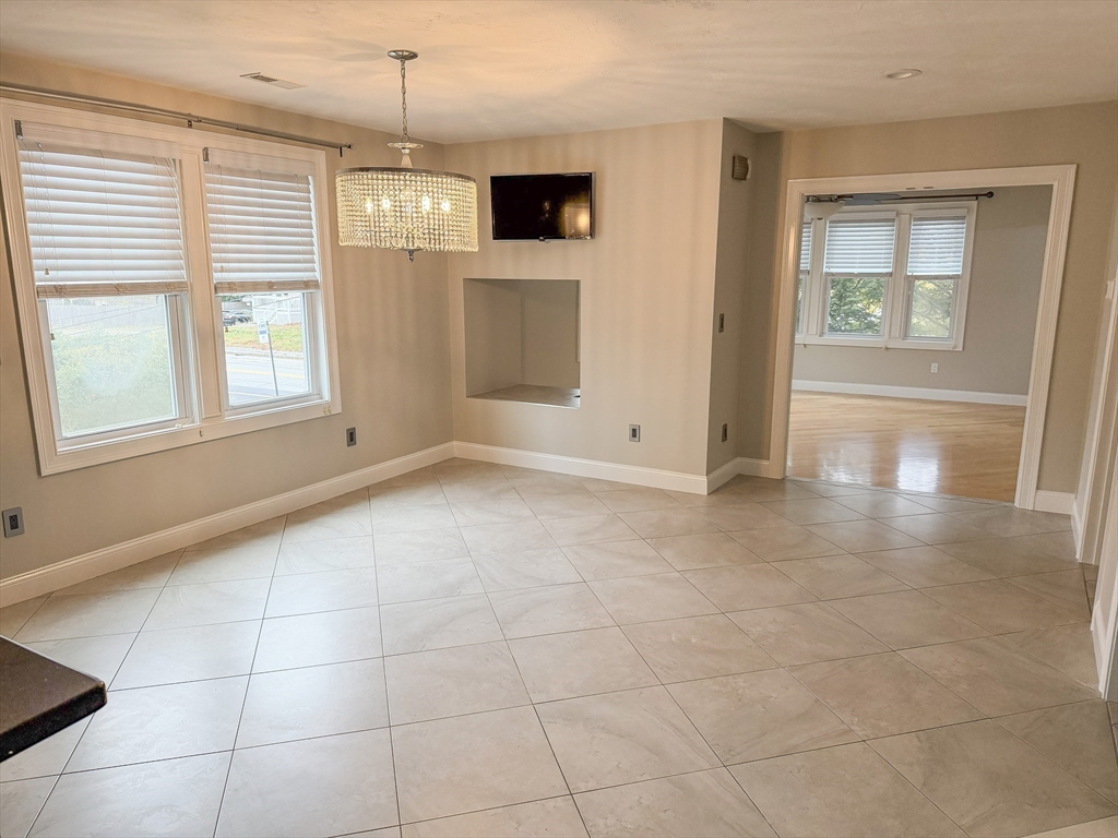 1132 West Boylston Street, Unit 2 Worcester, MA 01606 - Photo 6 of 42 a view of an empty room with a window