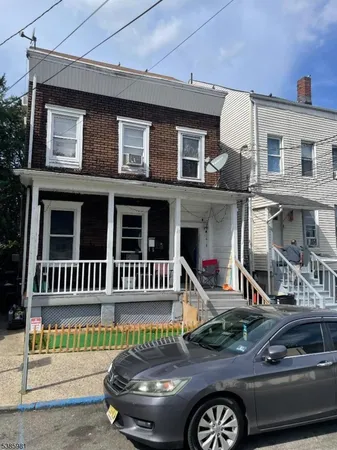 a front view of a house with parking