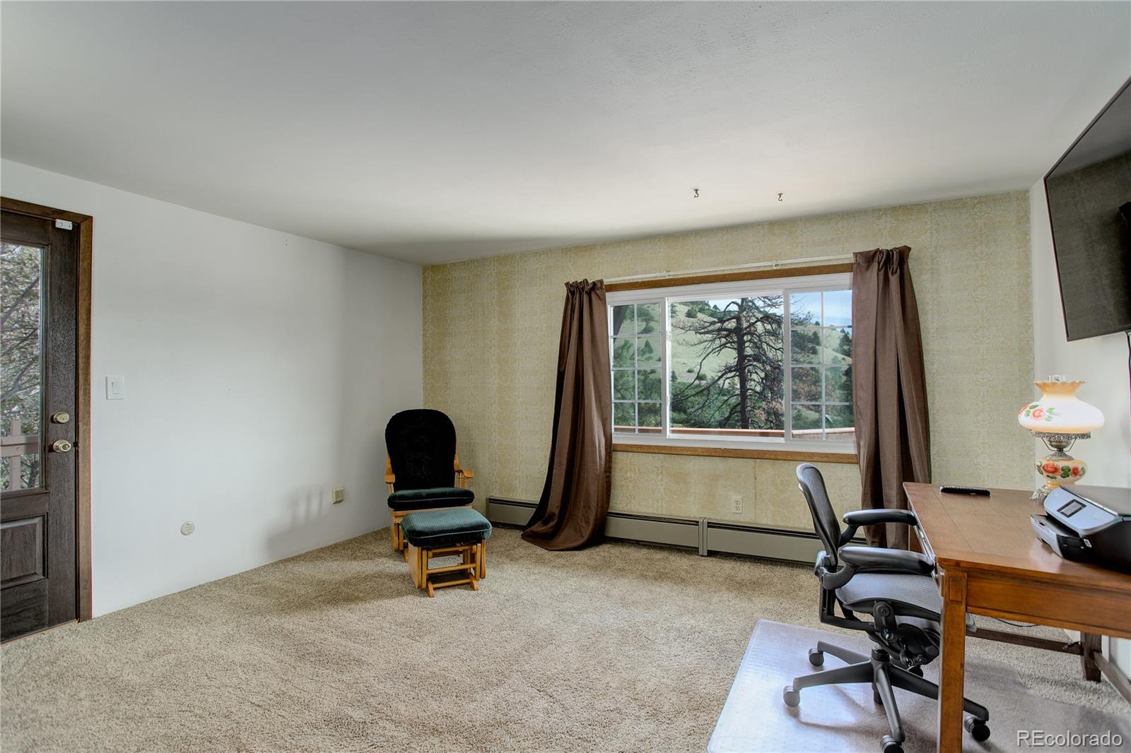 19285 Fox Den Way Morrison, CO 80465 - Photo 14 of 24 a living room with furniture and a window