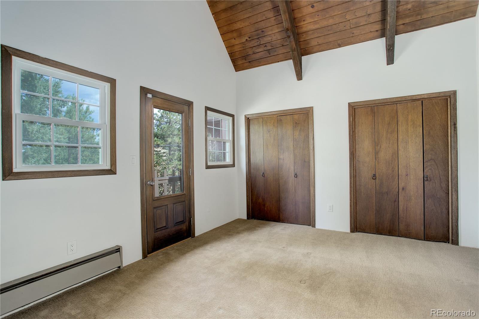 19285 Fox Den Way Morrison, CO 80465 - Photo 20 of 24 a view of an empty room with a window