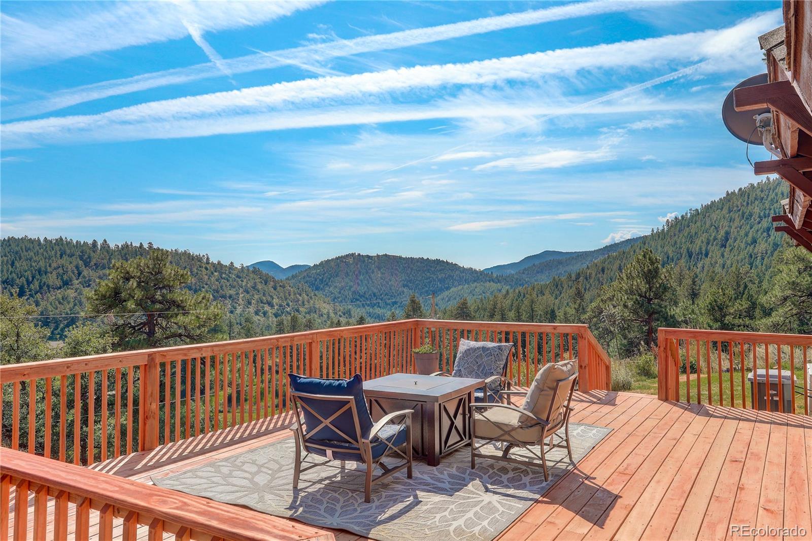 19285 Fox Den Way Morrison, CO 80465 - Photo 24 of 24 a view of a chairs and table on the roof deck
