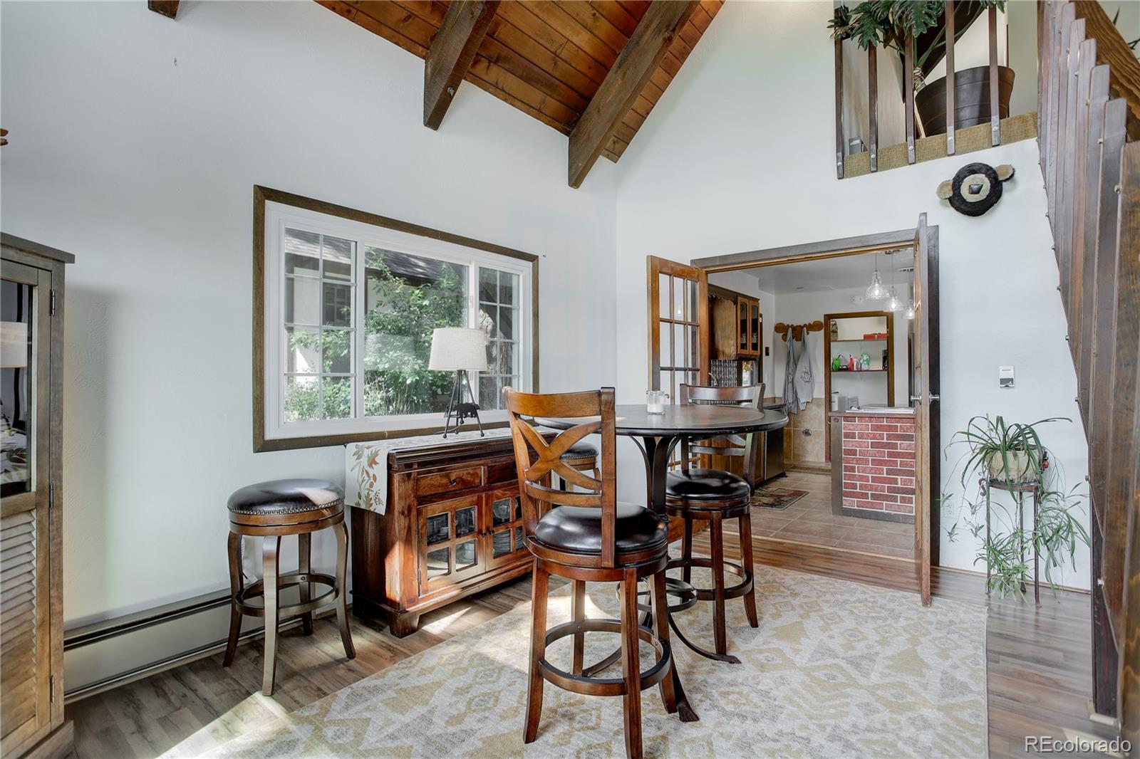 19285 Fox Den Way Morrison, CO 80465 - Photo 7 of 24 a view of a dining room with furniture and window