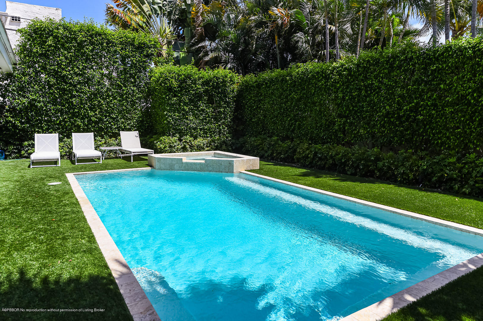 283 Valencia Road West Palm Beach, FL 33401 - Photo 21 of 23 a view of a backyard with swimming pool