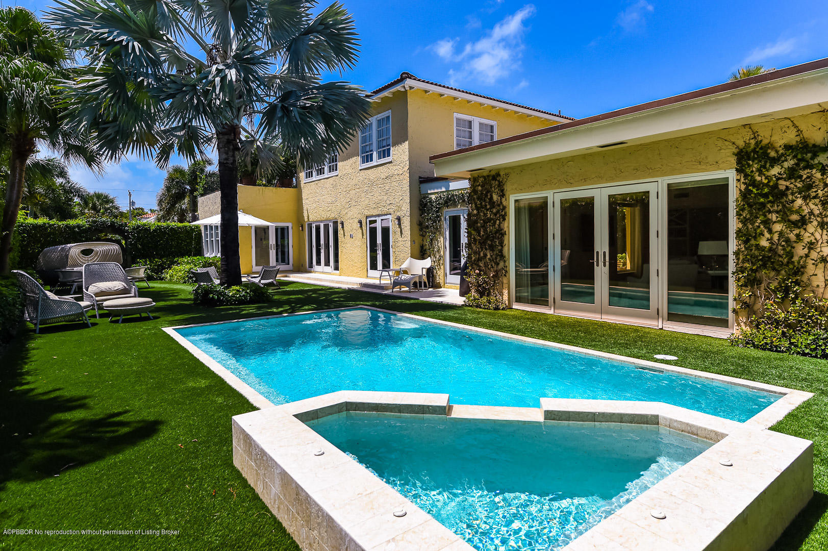 283 Valencia Road West Palm Beach, FL 33401 - Photo 22 of 23 a view of an house with swimming pool and chairs