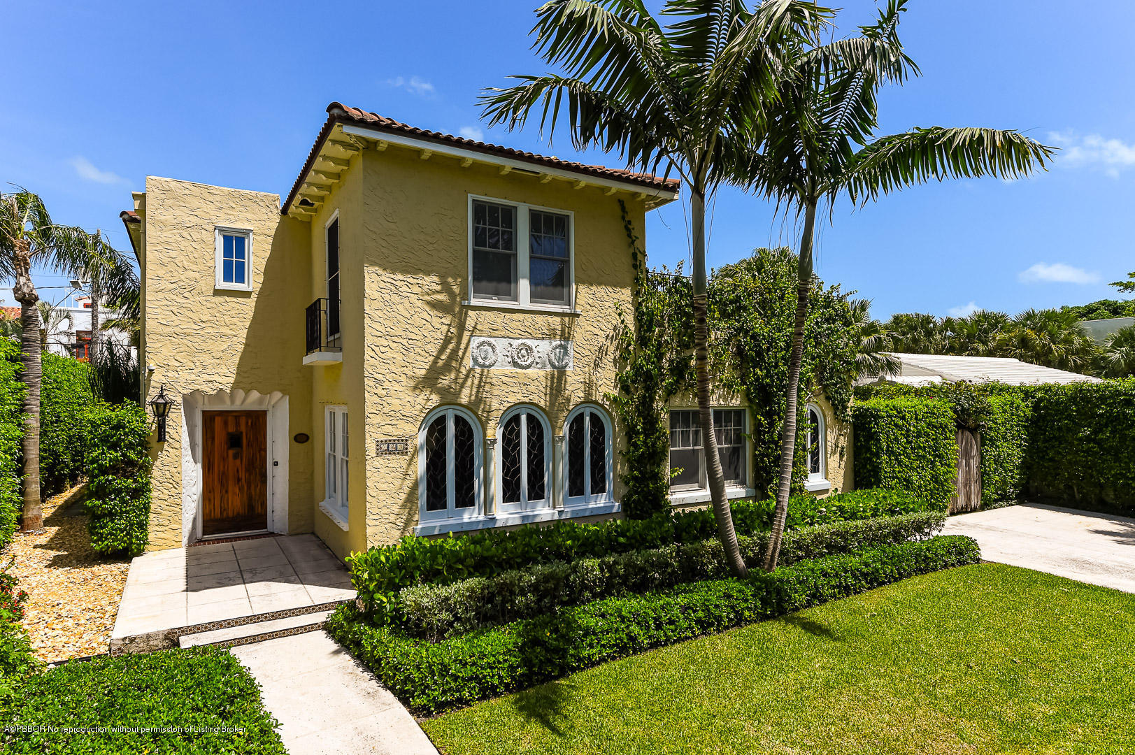 283 Valencia Road West Palm Beach, FL 33401 - Photo 23 of 23 a view of a house with a yard and palm trees