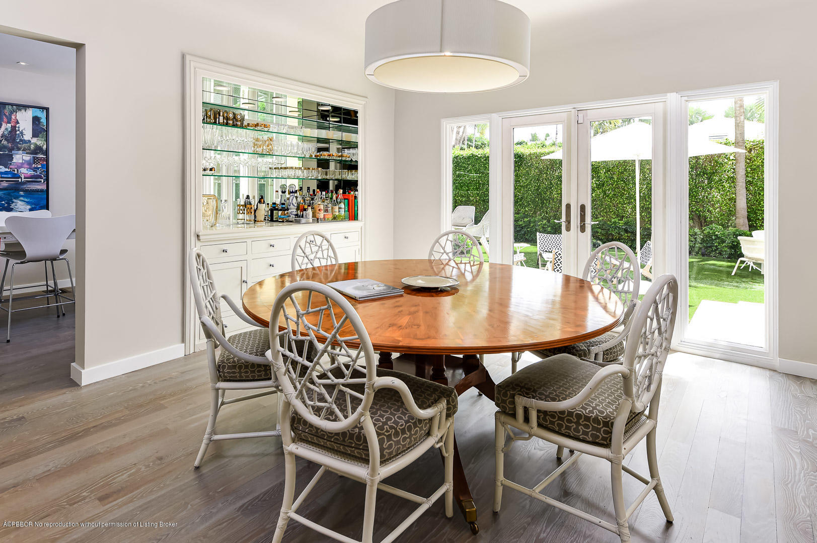 283 Valencia Road West Palm Beach, FL 33401 - Photo 5 of 23 a dining room with furniture window and wooden floor