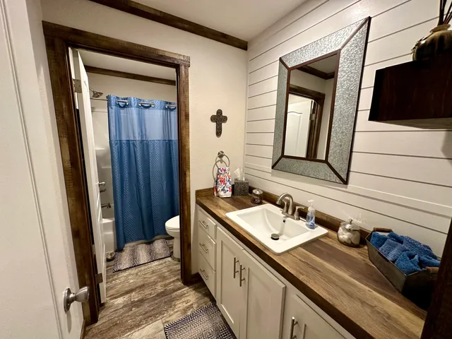 a view of living room with furniture and flat screen tv