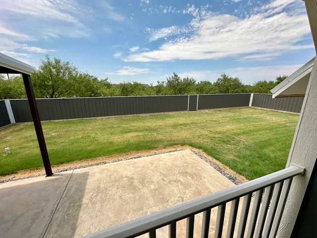 a living room with furniture gym equipment and a flat screen tv
