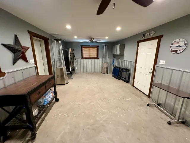 an aerial view of a house with yard and outdoor seating