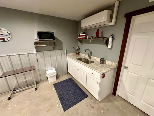 an aerial view of a house with yard and outdoor seating