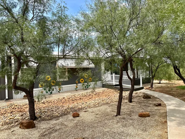 a bedroom with bed and window