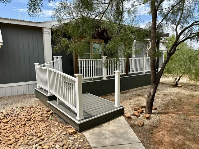 a spacious bedroom with a bed and a dresser