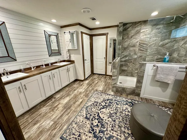 a kitchen with stainless steel appliances granite countertop a stove and a sink