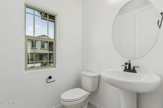 a view of a kitchen with a sink and a large window