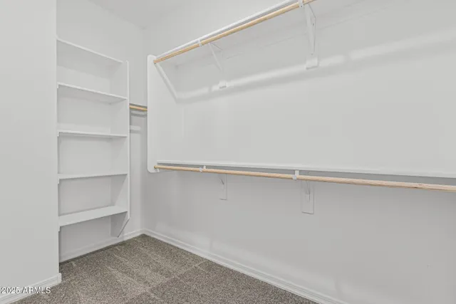a bathroom with a double vanity sink toilet mirror and shower