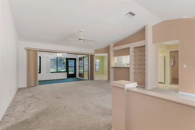 a view of an empty room with a window